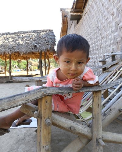 Myanmar, child, remote island next to minigrid installation