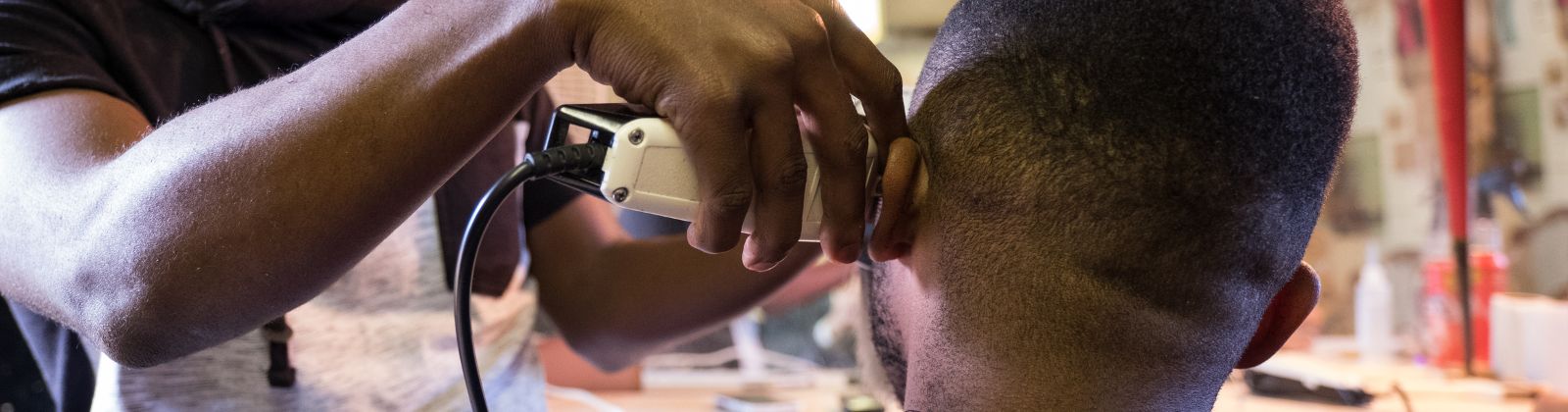 South Africa, man cutting hair. Getty Image