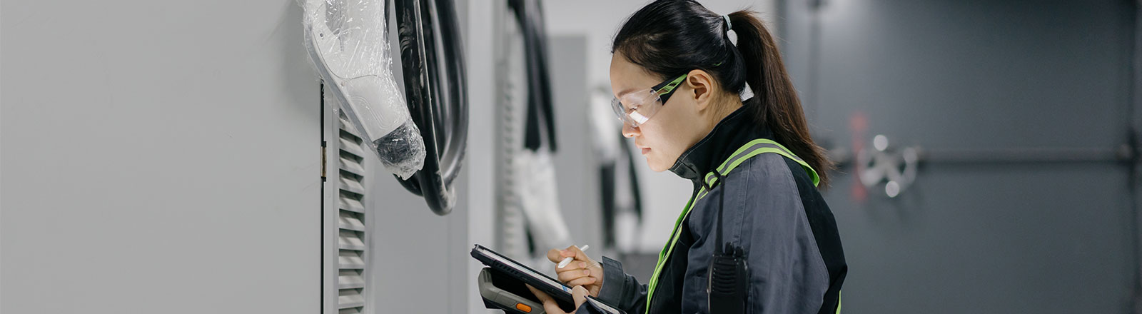 woman, engineer, installing mobile batteries