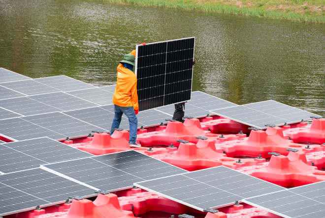 Close-up of a floating solar photovoltaic installation on a body of water.