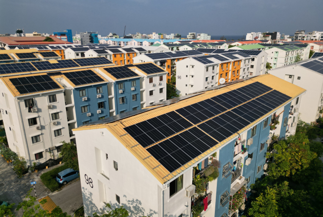 Residential housing units with rooftop solar panel installations