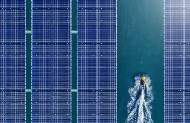 Close-up section of a photovoltaic solar panel displaying individual dark blue silicon solar cells