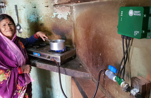 Person stirring food over a cookstove