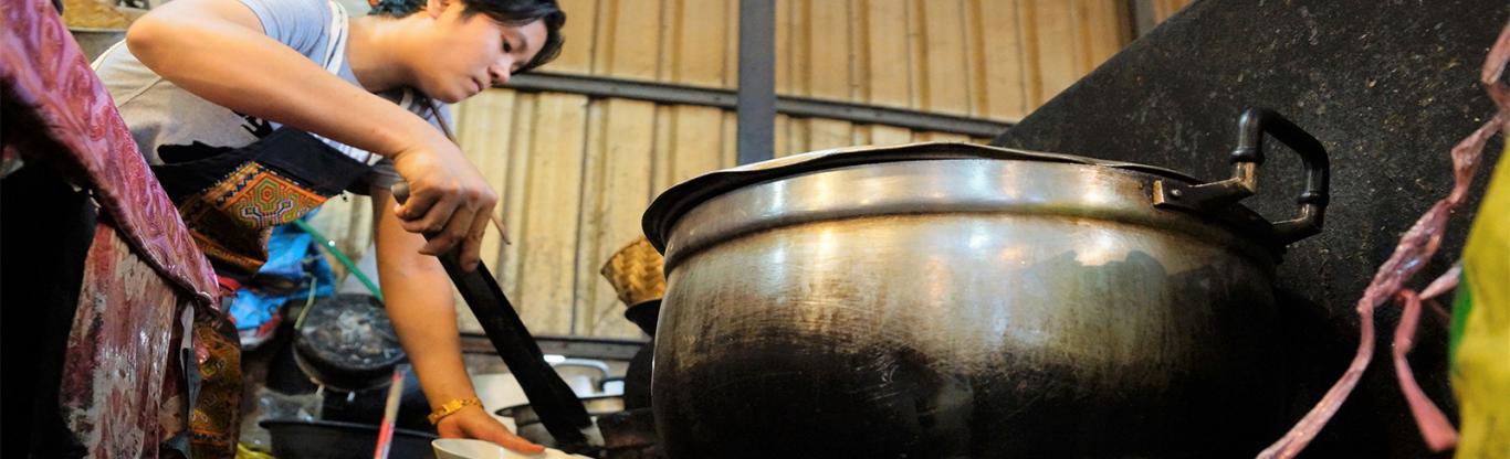 Laos, woman cooking