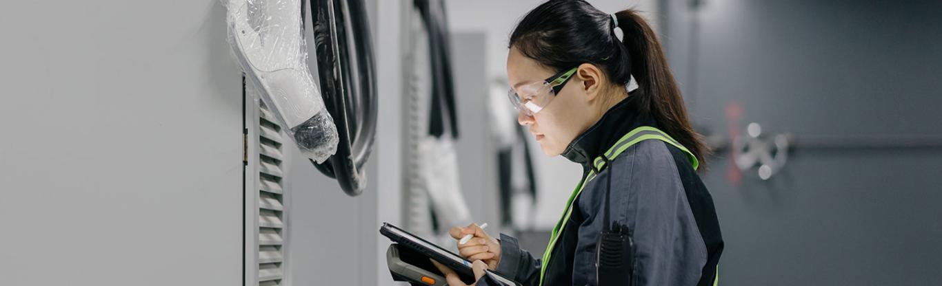 woman, engineer, installing mobile batteries