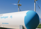 Tank for hydrogen storage and windmills in the background