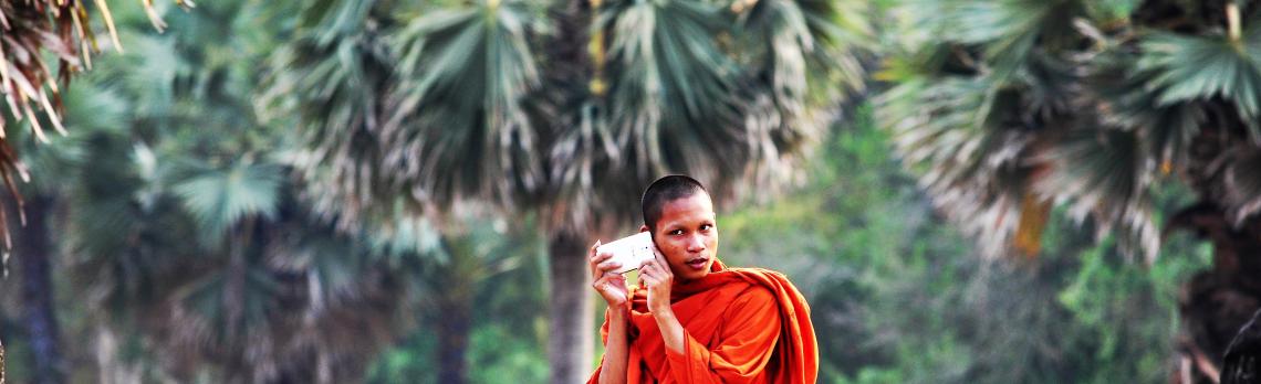 A Cambodian Monk listening to his cellphone. Photo by Amaryllis Liampoti A Cambodian Monk listening to his cellphone. Photo by Amaryllis Liampoti