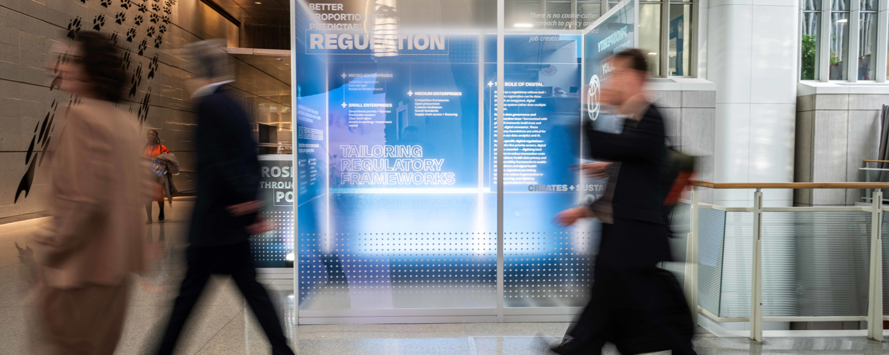 WORLD BANK GROUP HEADQUARTERS. 2026 IMF/ World Bank Group Spring Meetings. Photo: Ike Hayman / World Bank Blurry photo of people walking in a professional environment