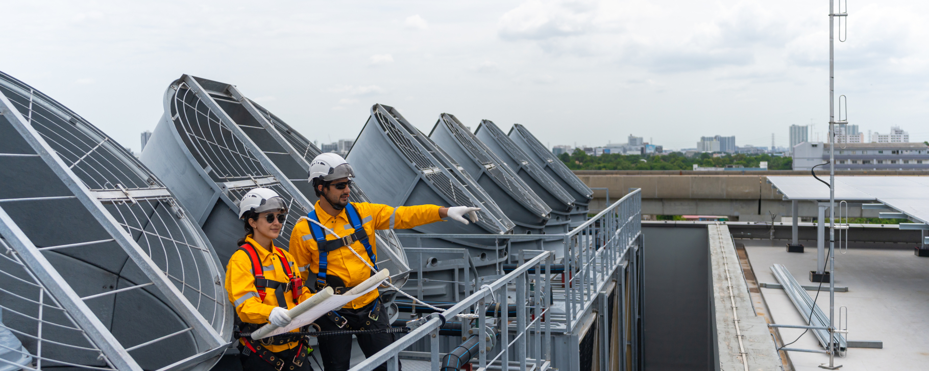 Construction worker performing cooling system repair