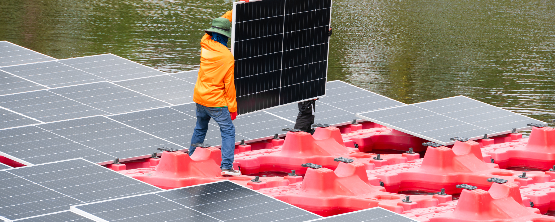 Floating solar photovoltaic panels installed on a body of water,