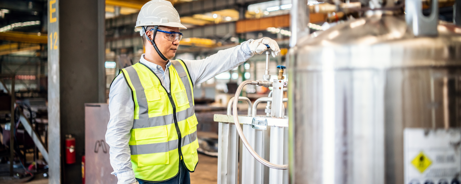 Person in a factory with a safety vest
