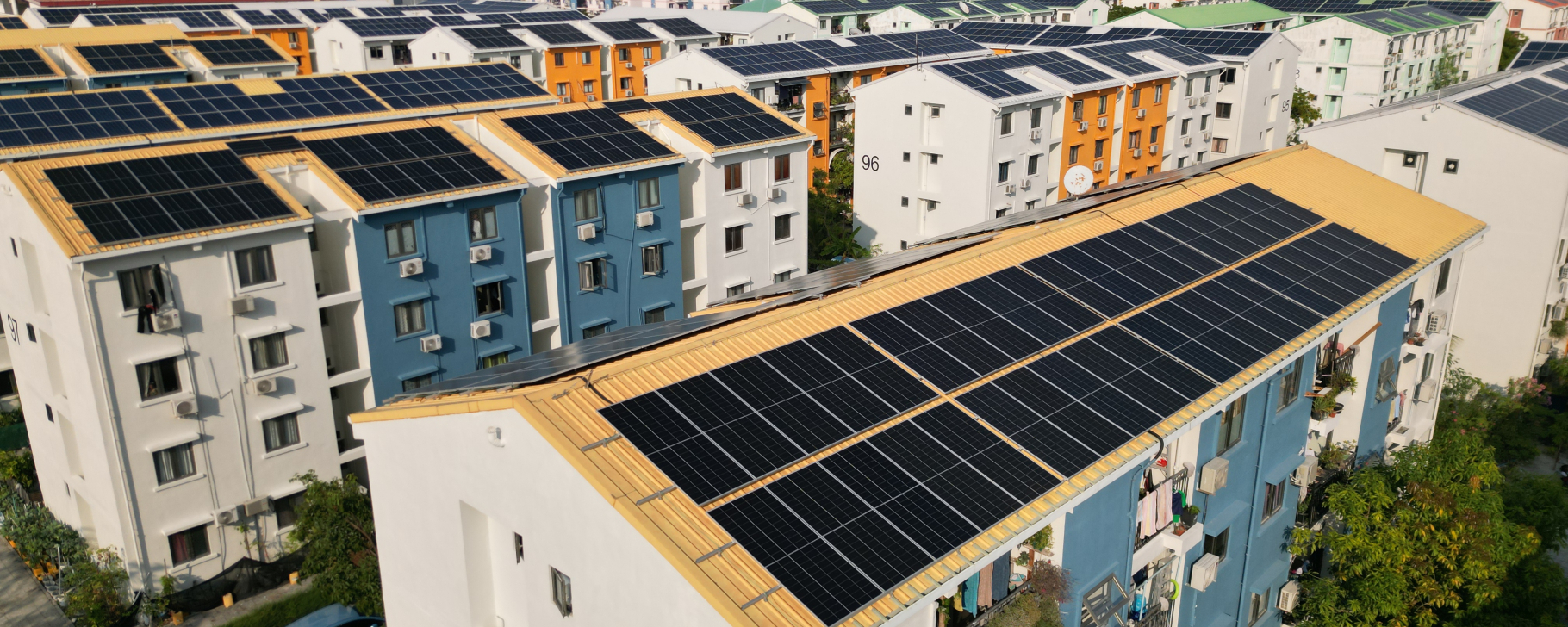 Residential housing units with rooftop solar panel installations