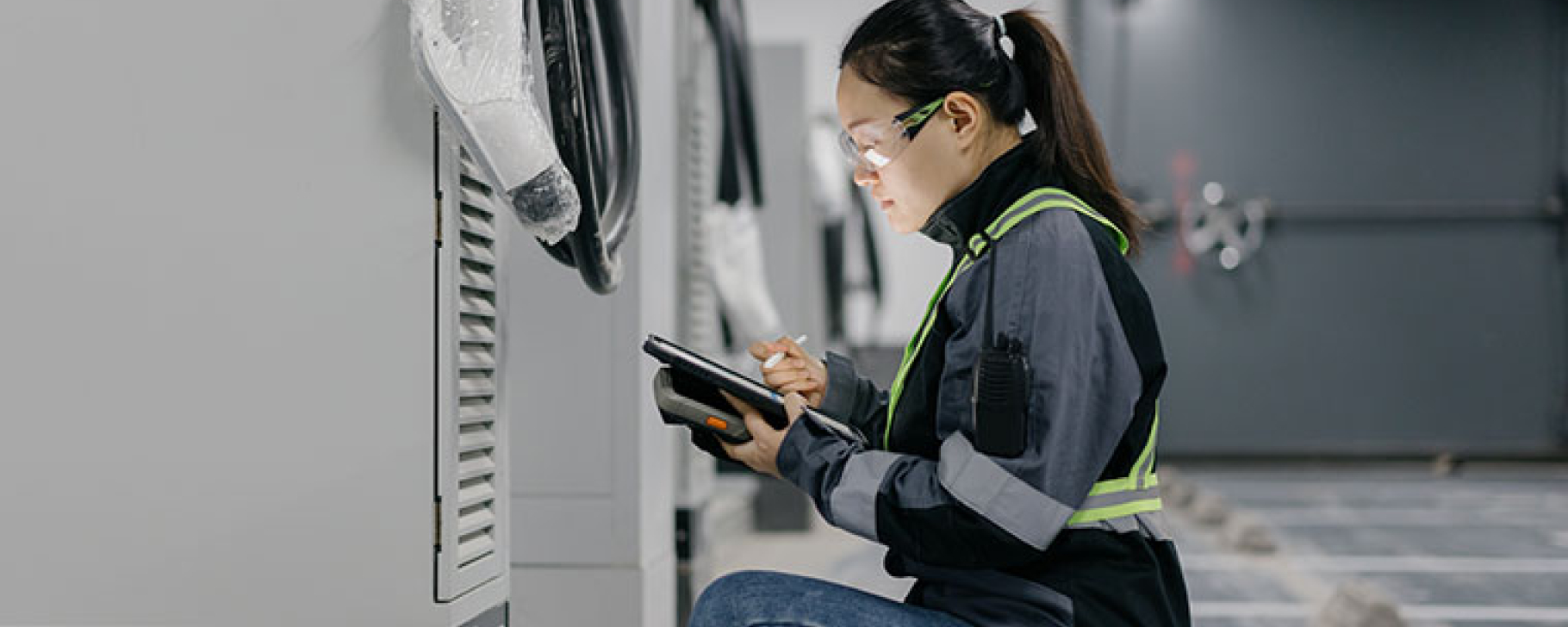 GettyImages by Sinology woman, engineer, installing mobile batteries