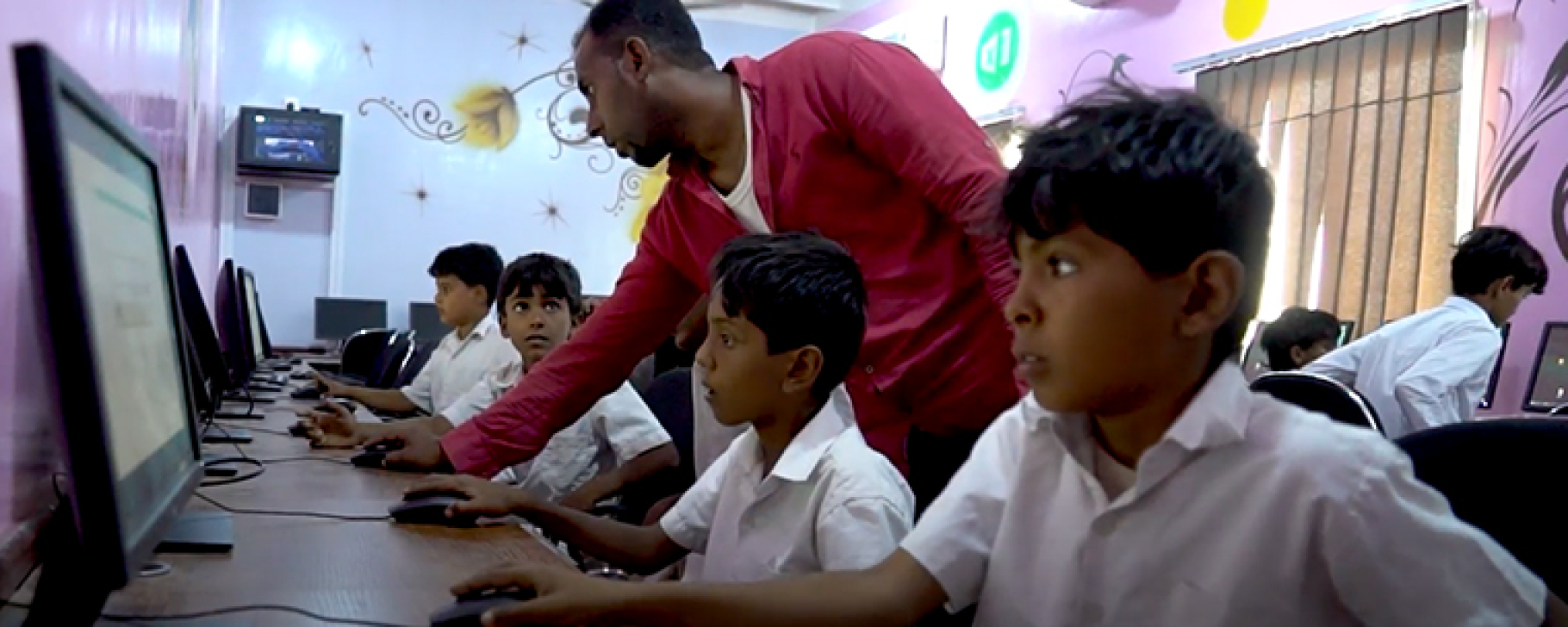 Image by UNOPS children working on computers in a school in Yemen