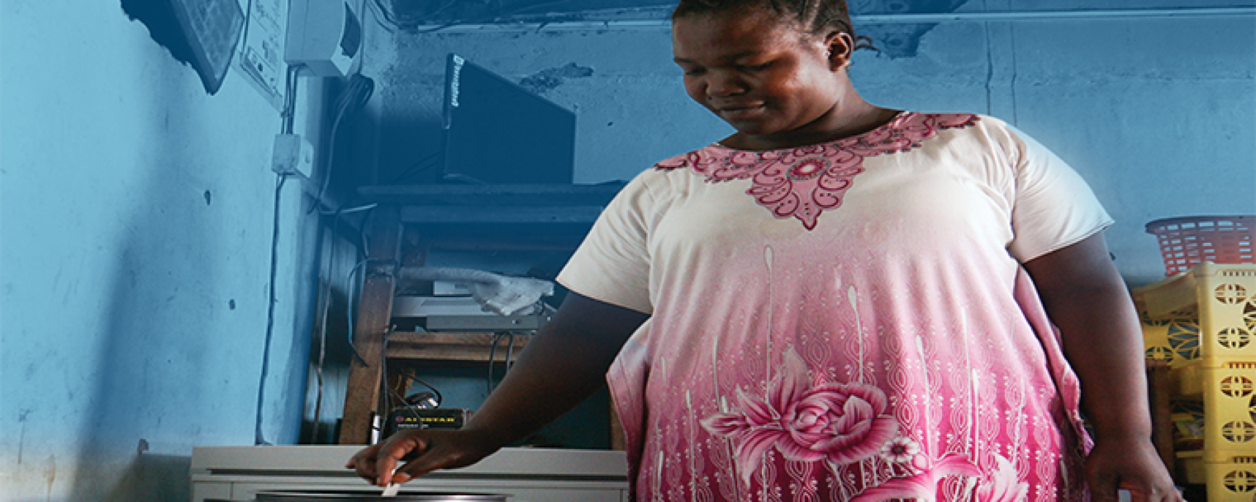 Woman cooking with electrical cooker woman, cooking, africa