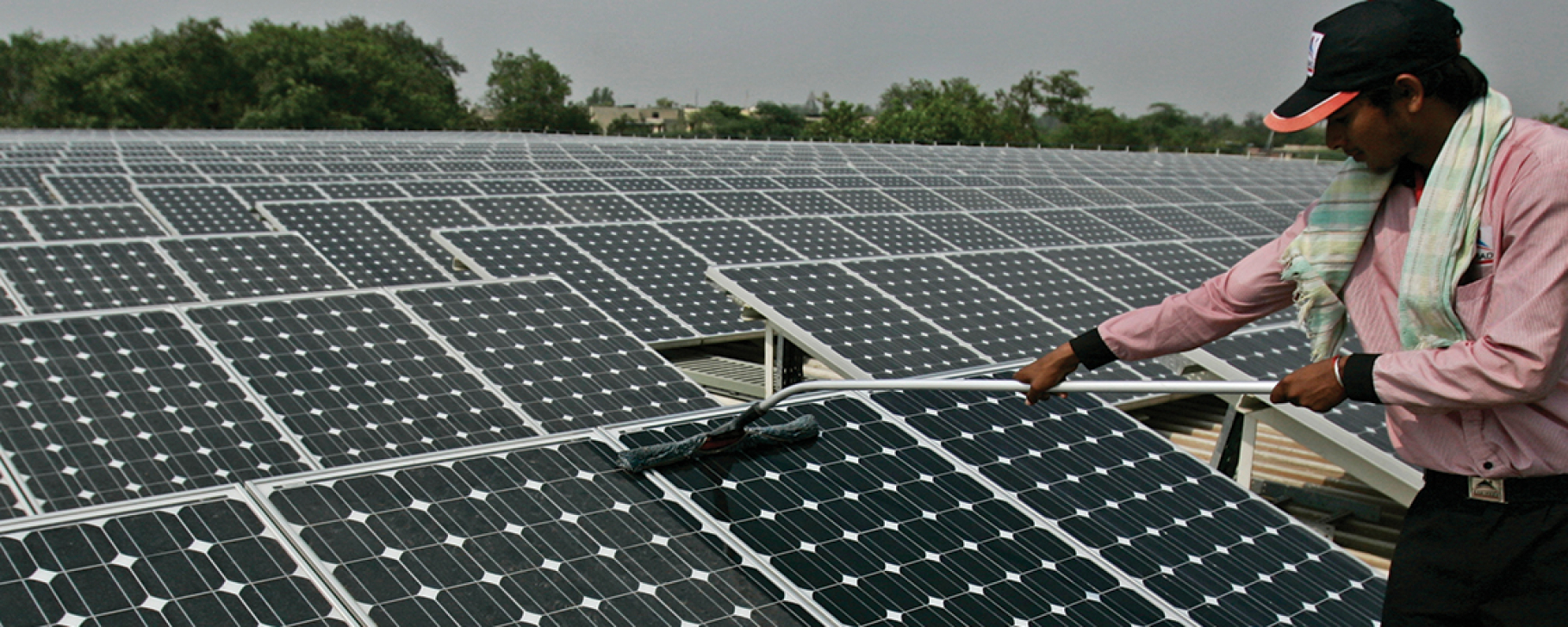 Solar Panel, worker cleaning PV panel Solar Panel, worker cleaning PV panel