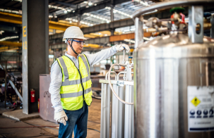 Person in a factory with a safety vest