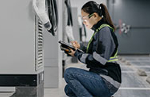 woman, engineer, installing mobile batteries