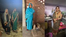 Three women stand in their homes in front of different cooking setups: one with traditional solid‑fuel stoves using wood or charcoal, and one with an LPG gas stove. The image illustrates household cooking transitions and differences in access to clean cooking fuels.