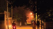 Boy riding bycicle at night