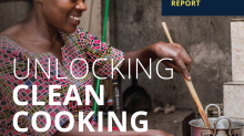 woman using improved cookstove