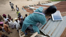 Togolese Solar Mamas successfully install a solar system, making their village clinic off-grid. Photograph by Lar Bolands.