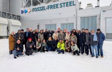 Group of people in a snow-covered steel plant