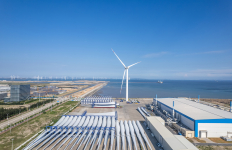 Aerial view of wind turbine propeller blades and wind power on the seaside