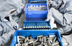 People in a factory working on batteries