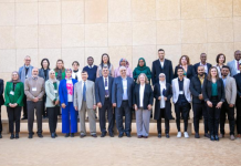 Scaling Up Energy Efficiency World Bank Energy Access & Transition Knowledge Academy A group of people standing next to each other in a room.