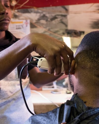 men cutting hair, South Africa