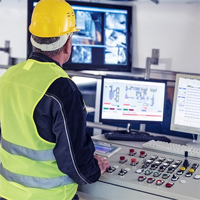 man working in a control room