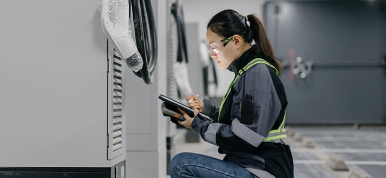 GettyImages by Sinology woman, engineer, installing mobile batteries